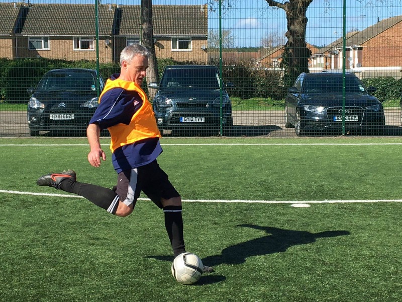 walking football phil kicking